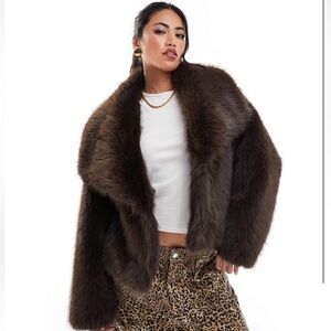 Brand new. Cropped faux fur jacket.